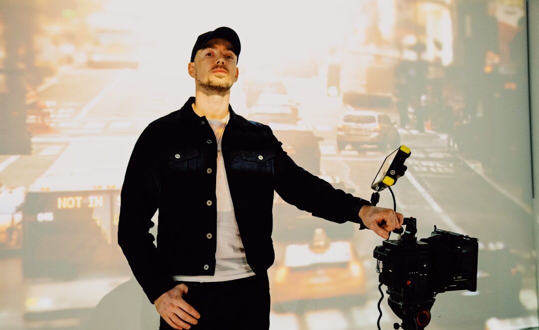 Presenter standing confidently in front of a television camera
